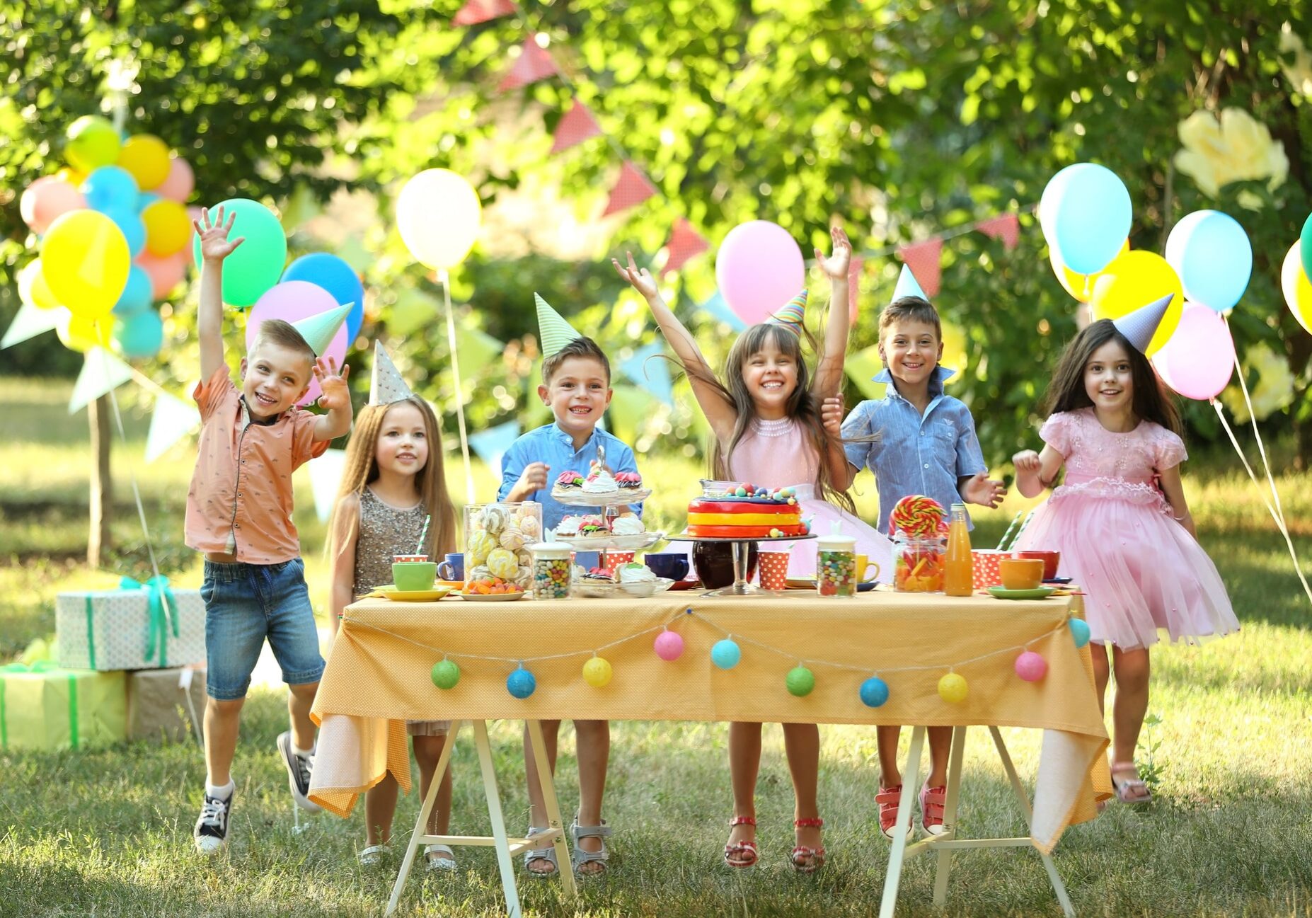 Children celebrating birthday in park