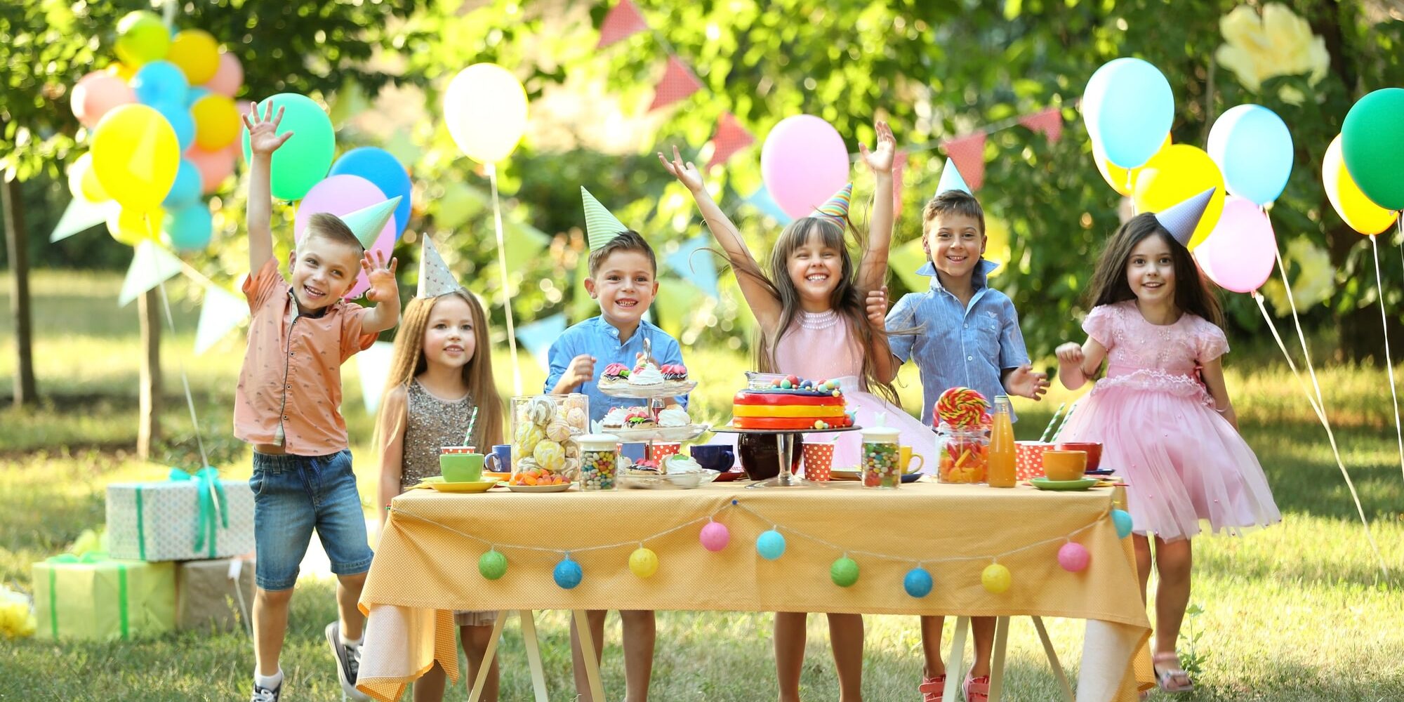 Children celebrating birthday in park